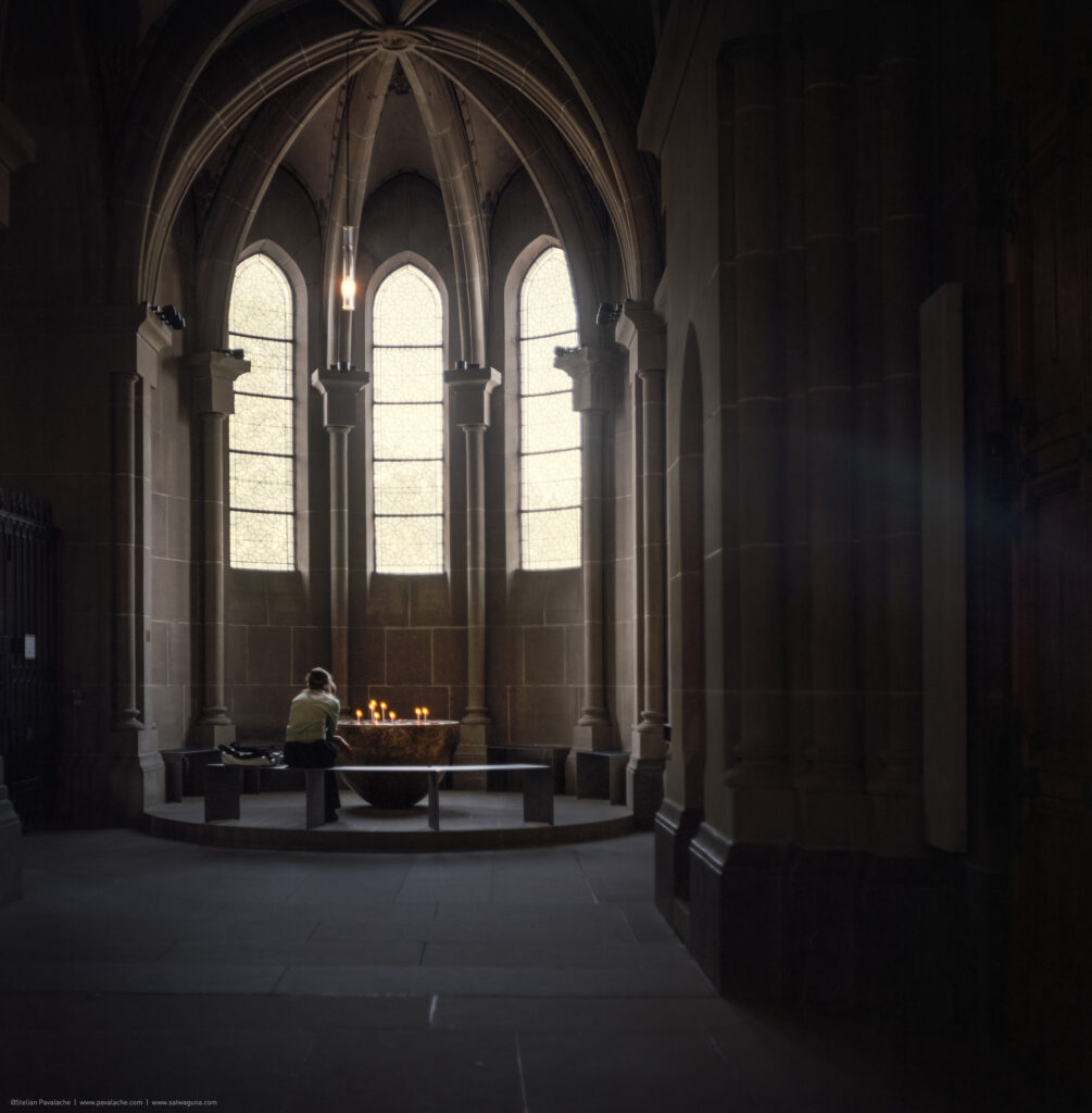 In the cage of stained light, where faith takes its first flight