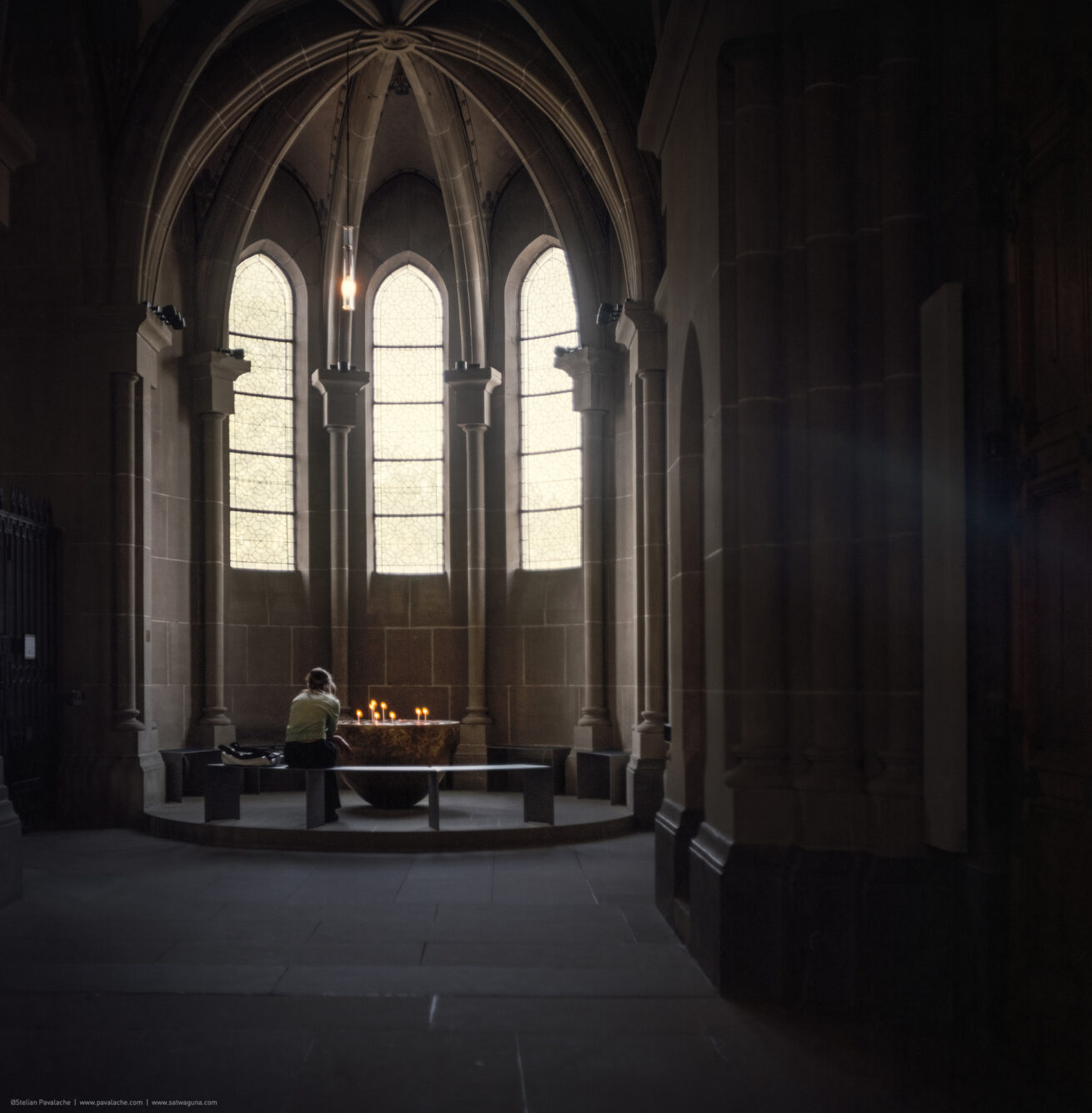 In the cage of stained light, where faith takes its first flight