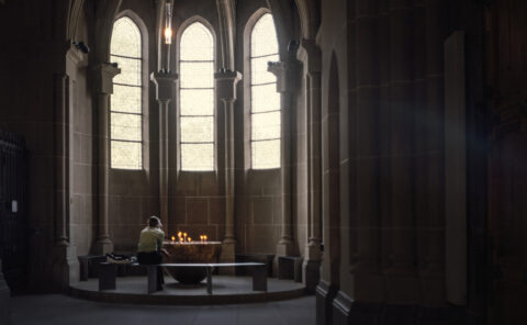 In the cage of stained light, where faith takes its first flight